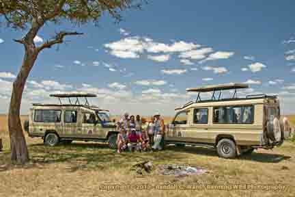 Safari vehicles, Masai Mara, Kenya